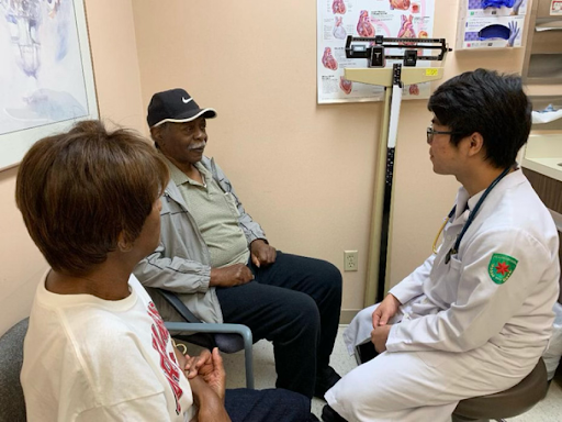 Medical student Duong Danh Nguyen Hien performing a physical examination and history taking.