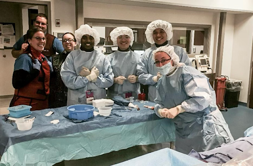 Medical students Mai Quang Minh and Le Bao Huy participating in coronary angiography and intervention for a patient with Acute Coronary Syndrome (ACS).