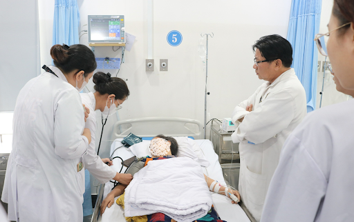 Students conducting physical examinations on patients under the close supervision of hospital physicians